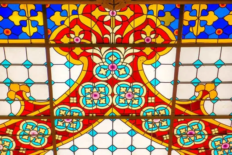Lello bookstore stained glass ceiling with a smilie