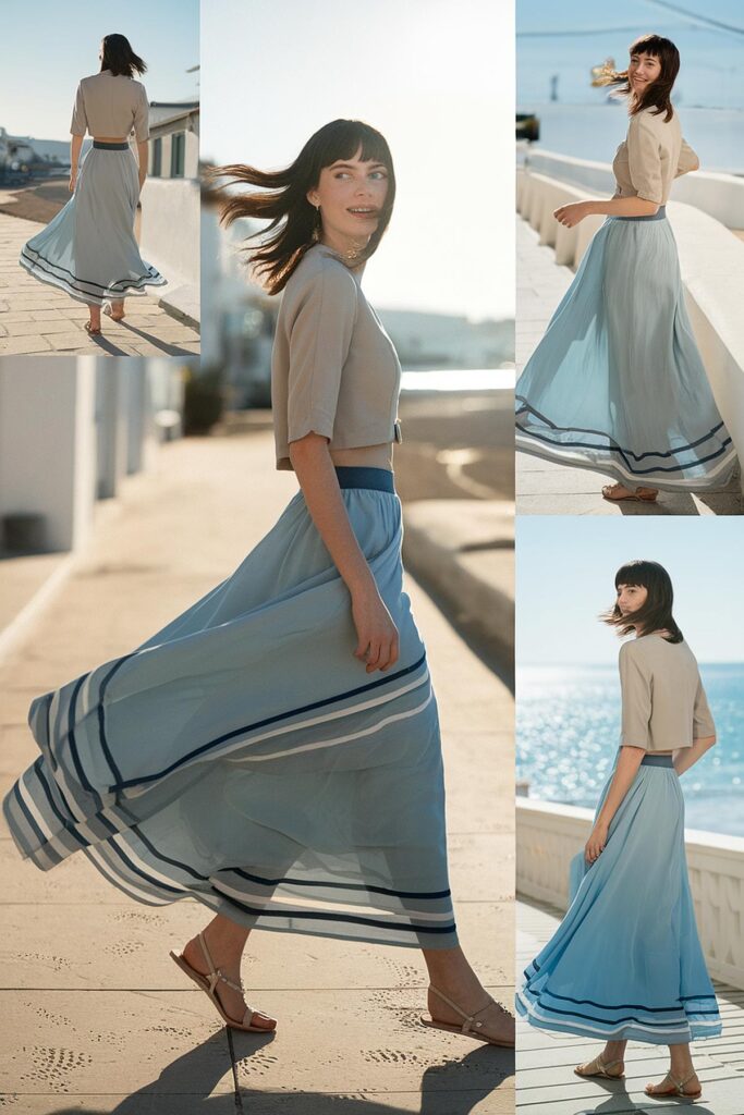 Woman in a flowing blue skirt walking along a sunlit path near the sea, capturing a carefree summer vibe.