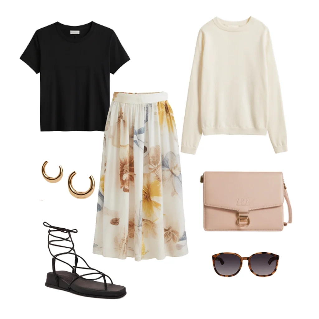 Floral skirt outfit with black top, cream sweater, sandals, sunglasses, gold earrings, and blush handbag.