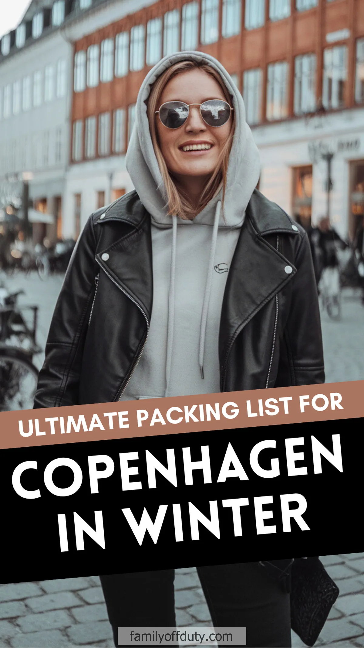 Woman in stylish winter outfit in Copenhagen; ultimate packing guide for cold weather travel.