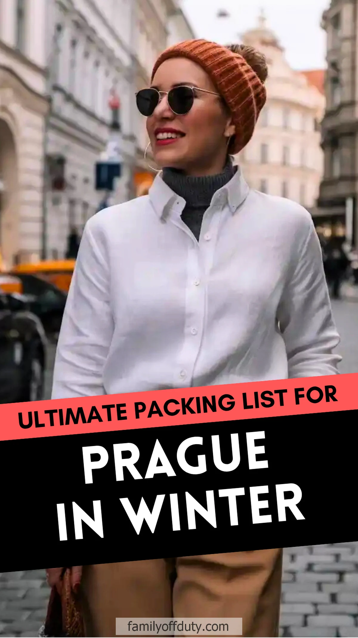 Woman in winter outfit in Prague street, wearing sunglasses and beanie. Ultimate winter packing guide.