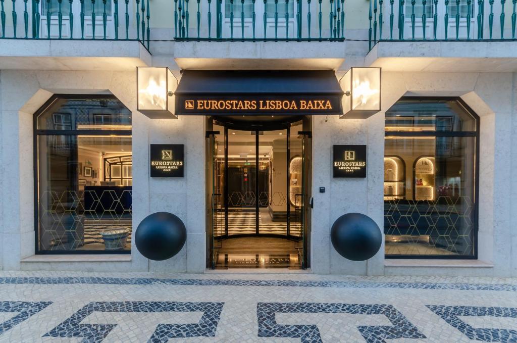 Facade of Eurostars Lisboa Baixa hotel with elegant entrance and modern design in Lisbon's city center.