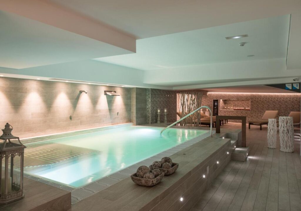 Relaxing indoor spa with a soothing pool and serene ambiance, perfect for unwinding and rejuvenation.