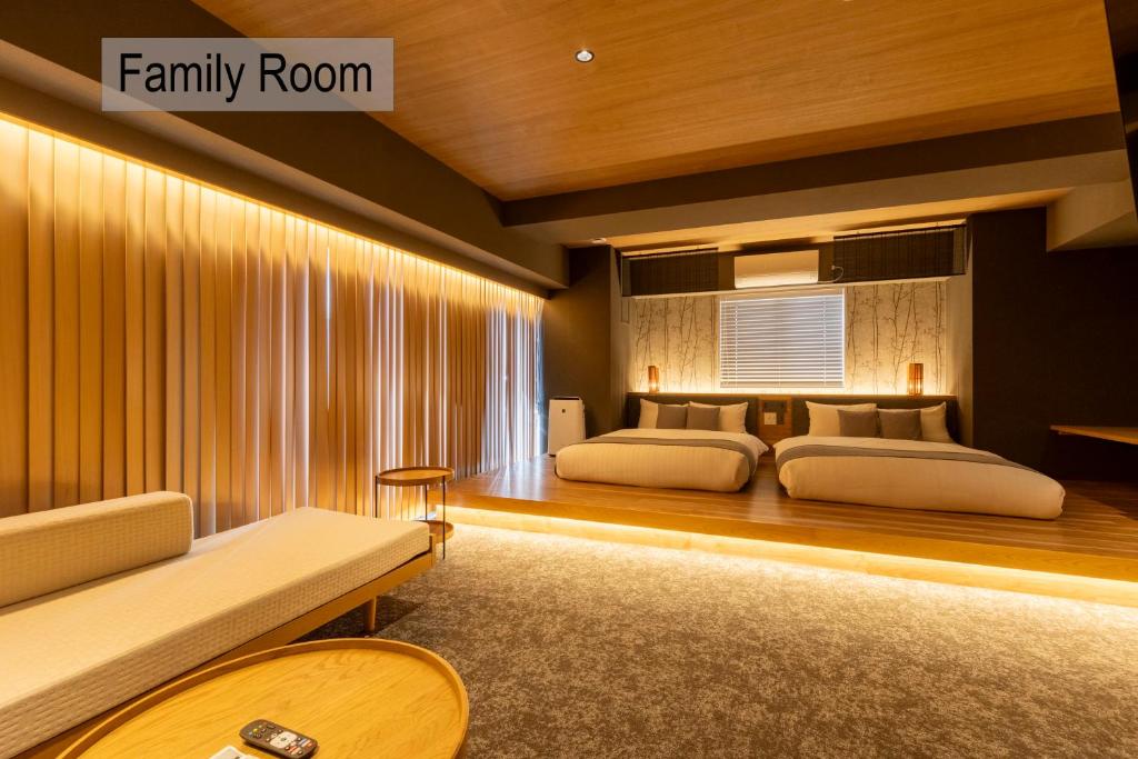 Spacious family room with cozy bedding, warm lighting, and modern decor, perfect for relaxation and family time.