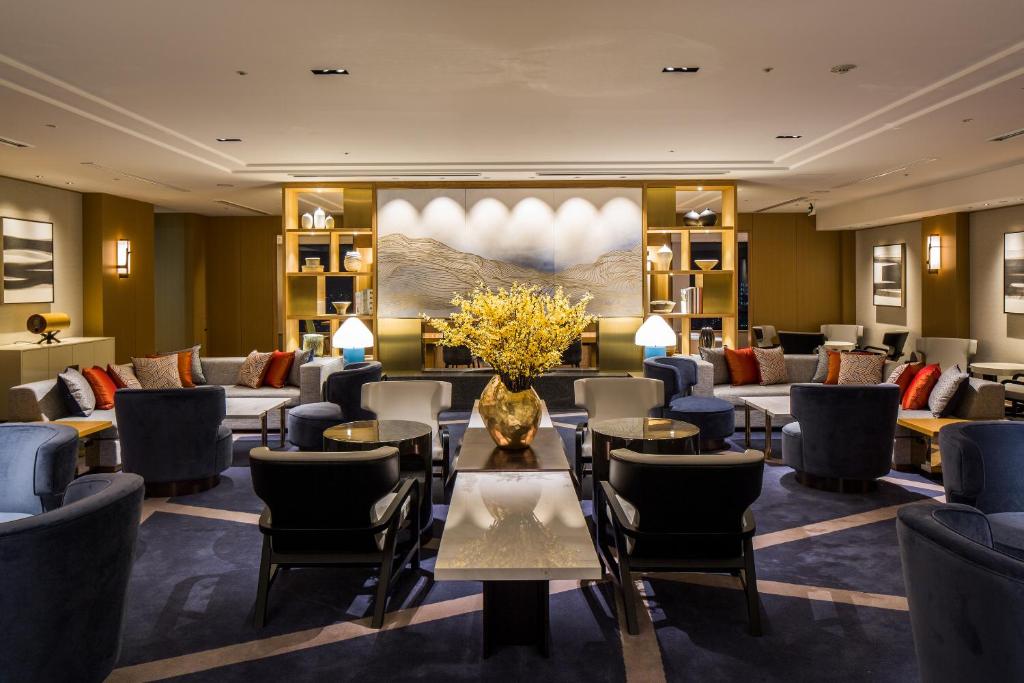 Luxurious lounge area with modern decor, featuring comfortable seating and elegant accents, perfect for relaxation.