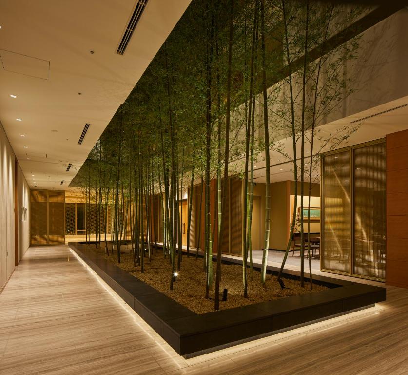 Modern interior with bamboo and ambient lighting, creating a serene atmosphere in a luxury setting.
