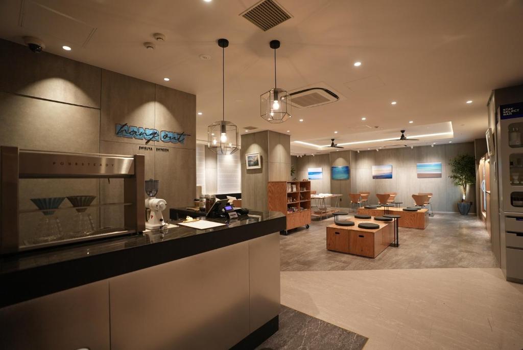 Modern café interior featuring a sleek counter, wooden seating, and contemporary artwork on the walls. Relaxing atmosphere.