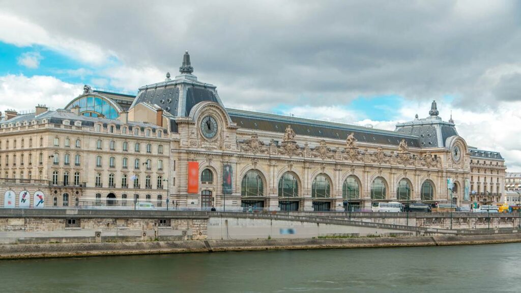 Exterior of the historic Musée d'Orsay in Paris, showcasing its grand architecture along the Seine River.