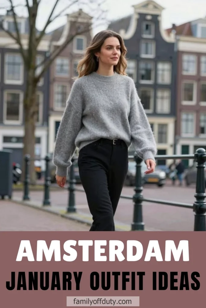 Woman in a grey sweater walking in Amsterdam, showcasing stylish January outfit ideas.