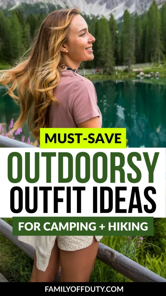 Smiling woman by a lake, showcasing trendy outfit ideas for camping and hiking in a scenic outdoor setting.