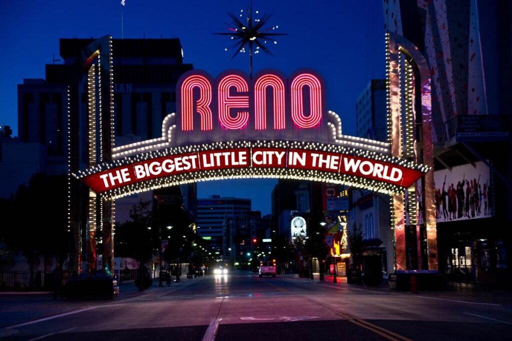 Reno city arch with neon lights, The Biggest Little City in the World, glowing at night.